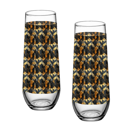 Two stemless champagne glasses with charcoal and bronze geometric design on a white background