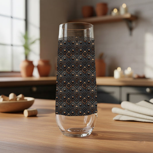 Foundry Coppers stemless champagne glass with a dark ash and copper discs design on a wooden table with blurred background