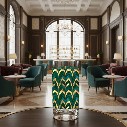 Emerald Royale highball glass with green and gold art deco design on a dark table in a luxurious interior lounge setting