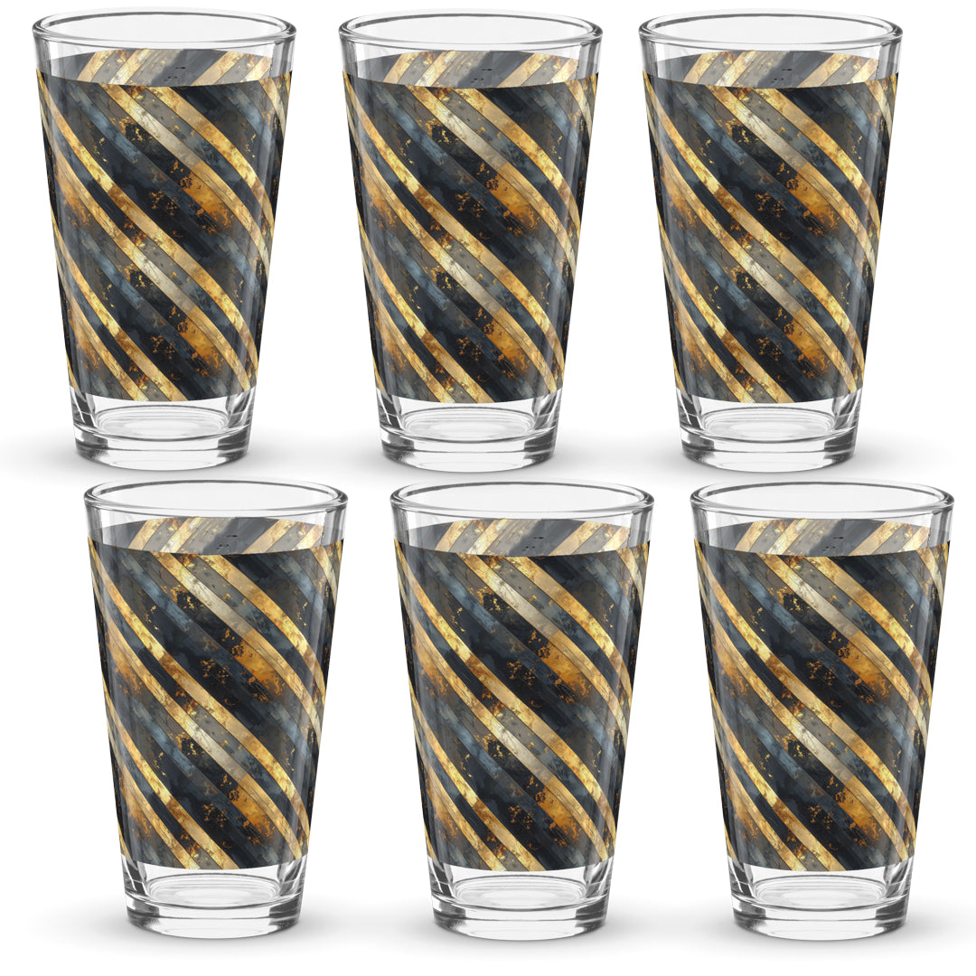 Set of six pint beer glasses with gold and black striped pattern on a white background