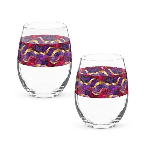 Two clear stemless wine glasses with purple and gold colorful pattern on a white background
