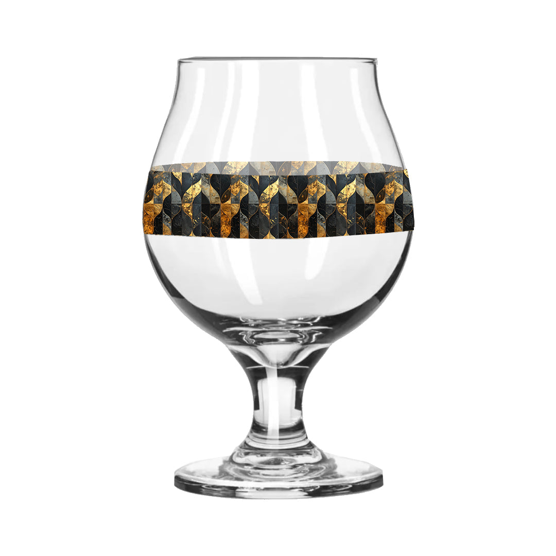 Belgian beer glass with charcoal and bronze geometric design on a white background