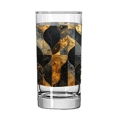 Highball glass with a charcoal and bronze geometric design on a white background