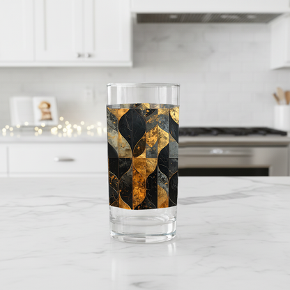 Aged Elegance highball glass with black and bronze design on a kitchen counter