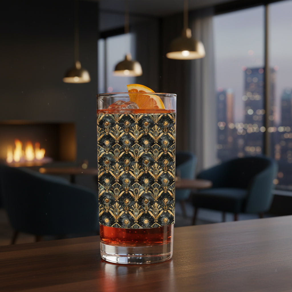 Astral Glow highball glass with  a black and bronze design, filled with a cocktail on a table in a stylish room with cityscape view