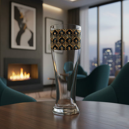 Astral Glow pilsner beer glass with  a black and bronze design on a table in a modern living room.