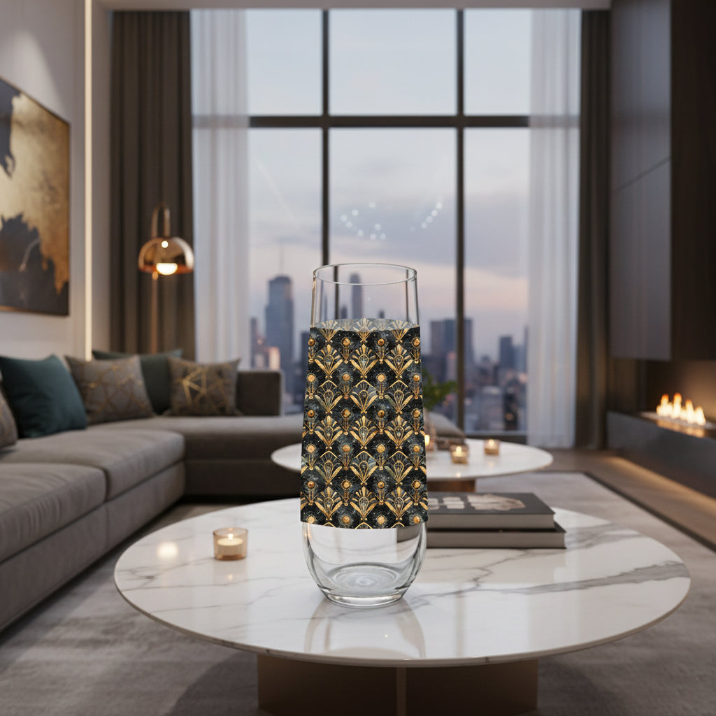 Astral Glow stemless champagne glass with  a black and bronze design sitting on a marble coffee table in a modern living room.