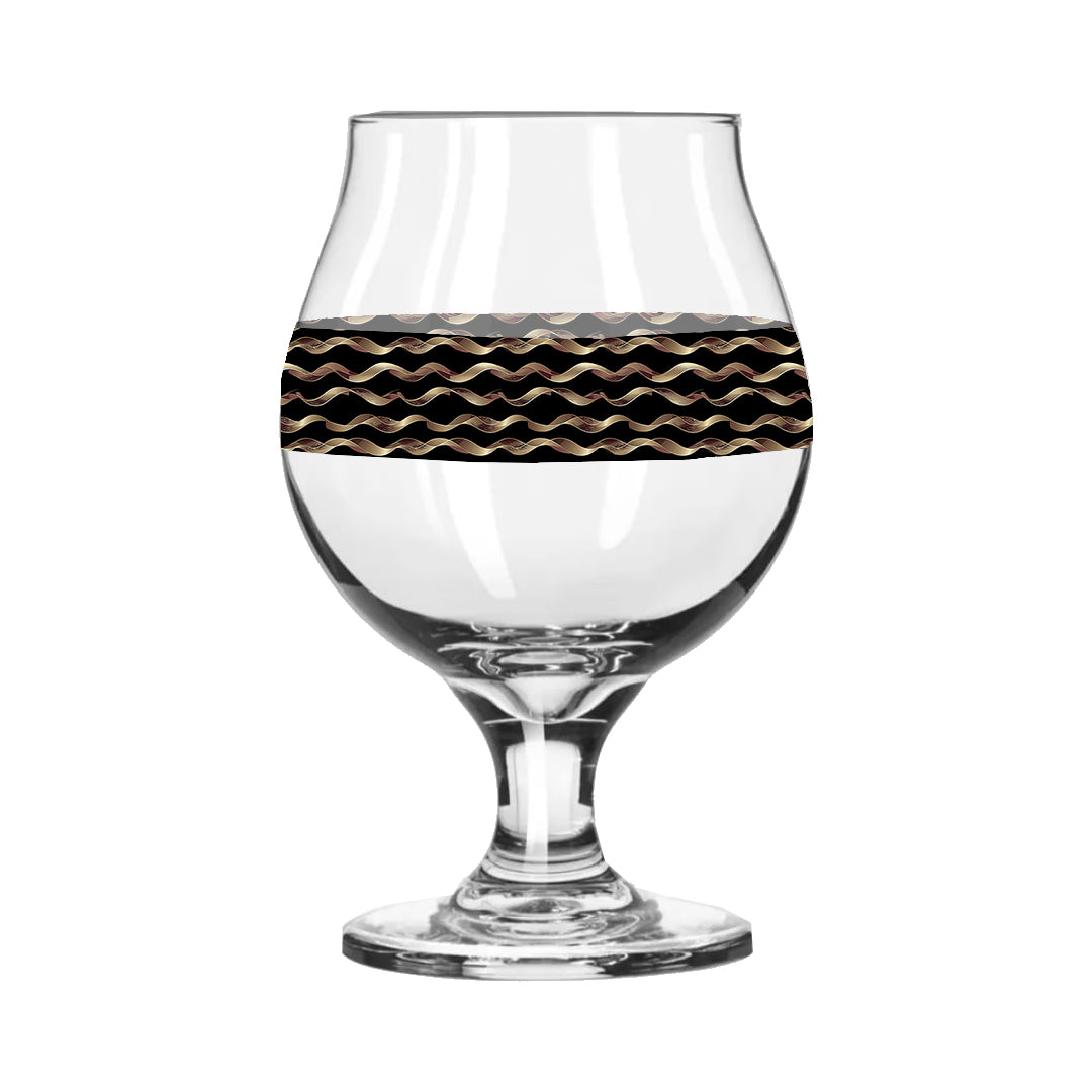 Clear glass with black and gold wavy pattern on a white background