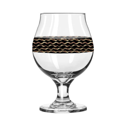 Clear glass with black and gold wavy pattern on a white background