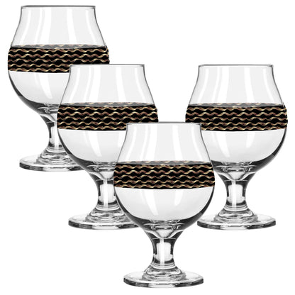 Set of four clear glasses with black and gold wavy pattern on a white background