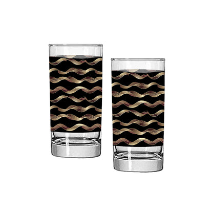 Two highball glasses with black and gold wavy pattern on a white background