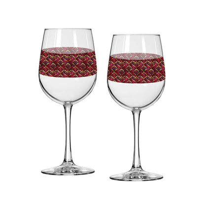 Two Crimson Jewels tall wine glasses with red and gold design around the middle on a white background