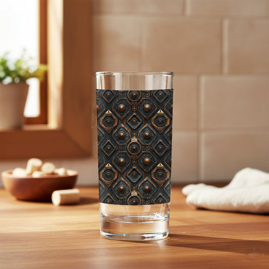 Foundtry Coppers highball glass with a dark ash discs design on a wooden surface and a blurred background