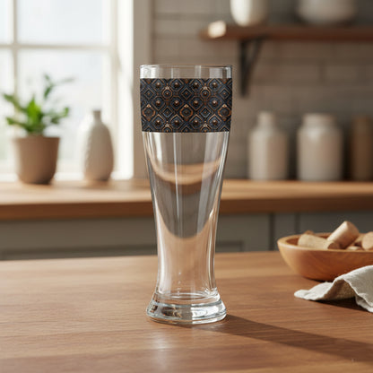 Foundry Coppers pilsner beer glass in a dark ash and copper discs design on a wooden table in a kitchen setting