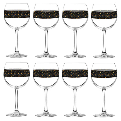 Set of eight balloon wine glasses with black and gold diamond design on a white background