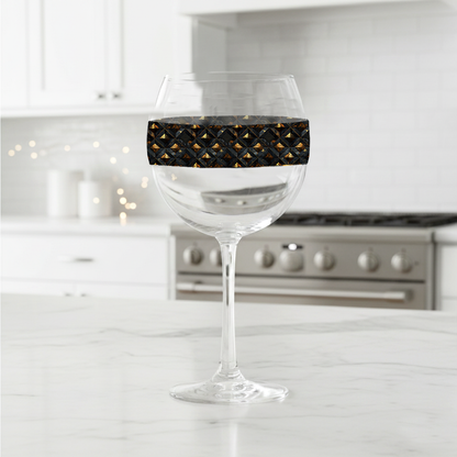 Gilded Decay balloon wine glass with black and gold geometric design on a kitchen counter
