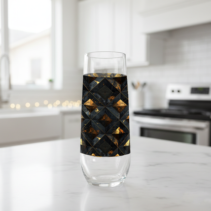 Gilded Decay stemless champagne glass with charcoal and gold geometric with black design on a kitchen counter