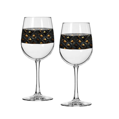 Two wine glasses with black and gold diamond design on a white background
