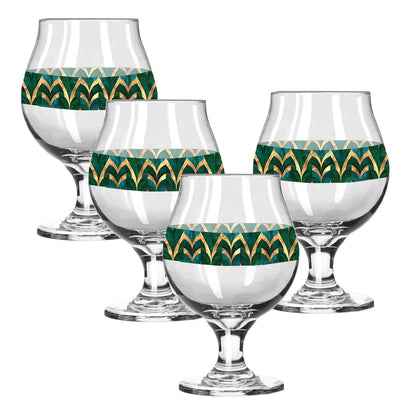 Set of four Belgian beer glasses with with green and gold geometric design on a white background