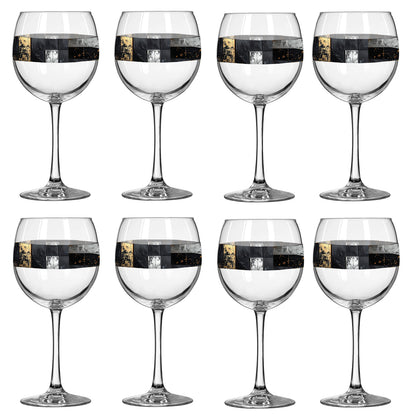 Set of eight Fresco Fragments balloon wine glasses with black, silver, and gold design on a white background