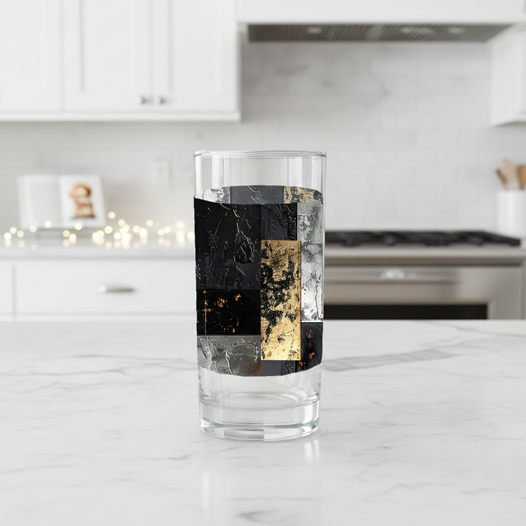 Frescro Fragments highball glas  with black, silver, and gold design on a kitchen counter