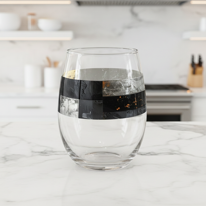 Fresco Fragments stemless glass with black, silver and gold pattern on a marble countertop