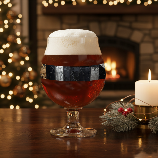 Fresco Fragments pattern Belgian glass of dark beer with foam, Christmas tree, and candle in the background