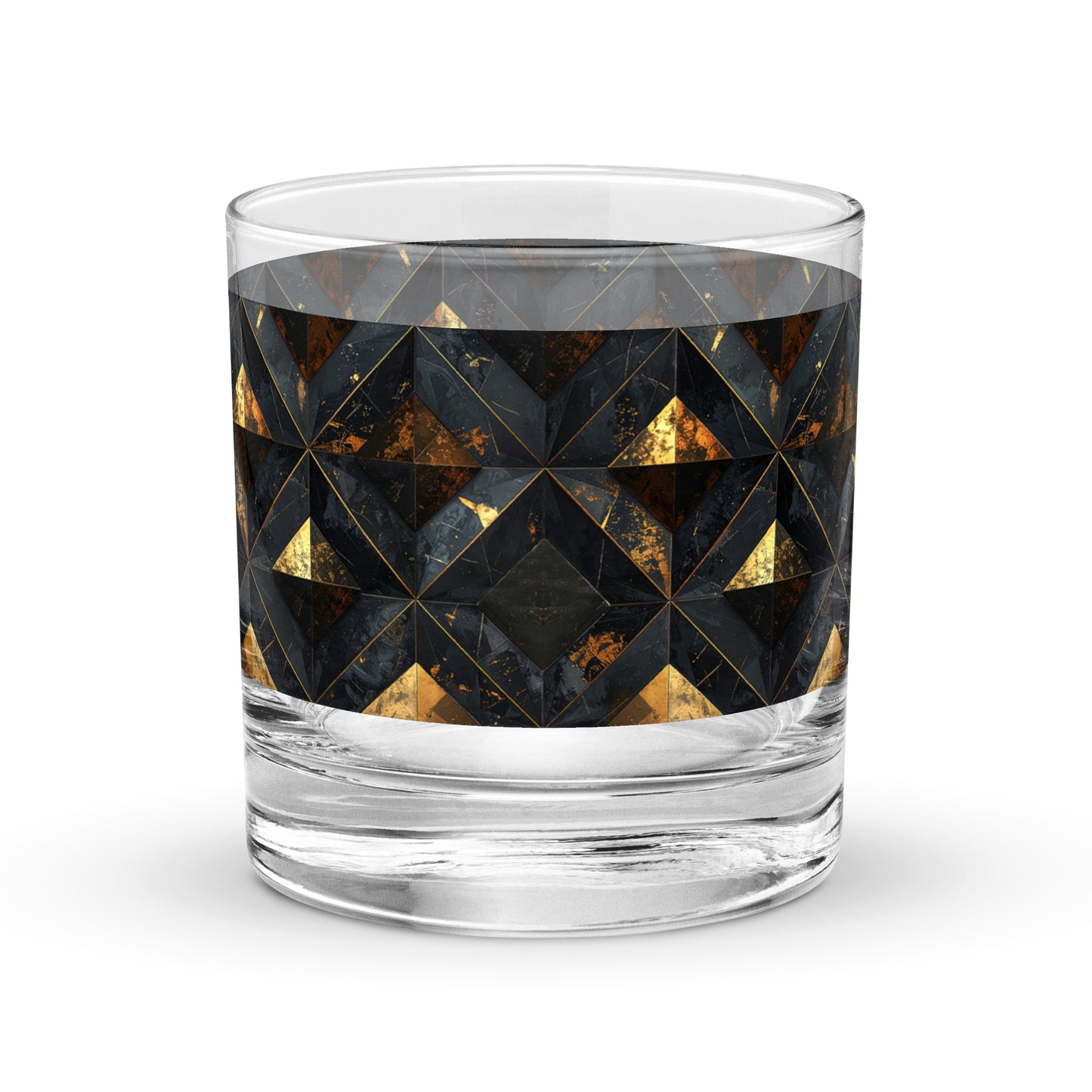 Rock glass with black and gold geometric pattern on a white background