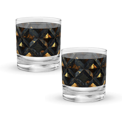 Two rock glasses with geometric black and gold pattern on a white background