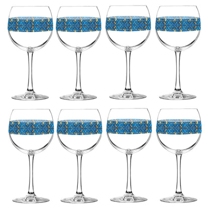 Set of eight balloon wine glasses with turqoise and gold geometric design on a white background