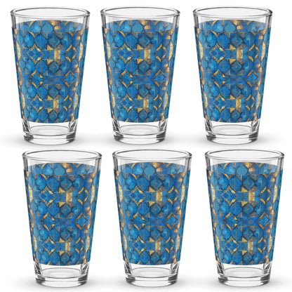Set of six pint beer glasses with turqoise and gold geometric design on a white background