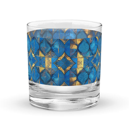 Glass rocks glass with turqoise and gold geometric design on a white background