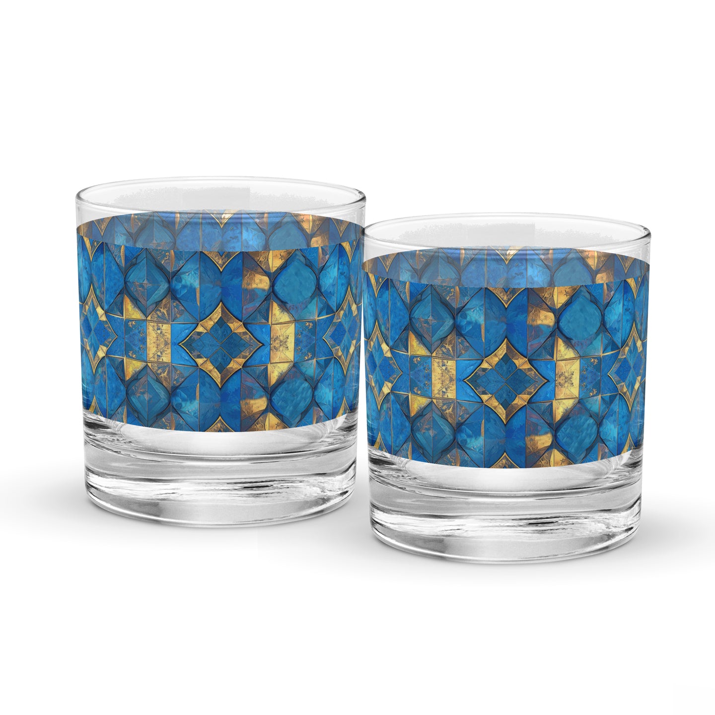 Two rock glasses with turqoise and gold geometric design on a white background