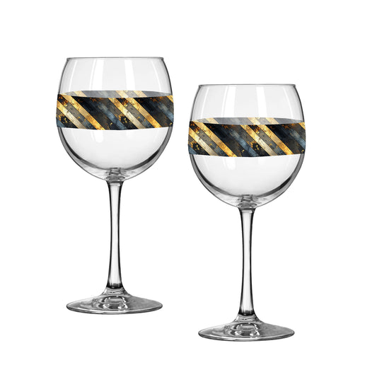 Two balloon wine glasses with black and gold striped desig on a white background