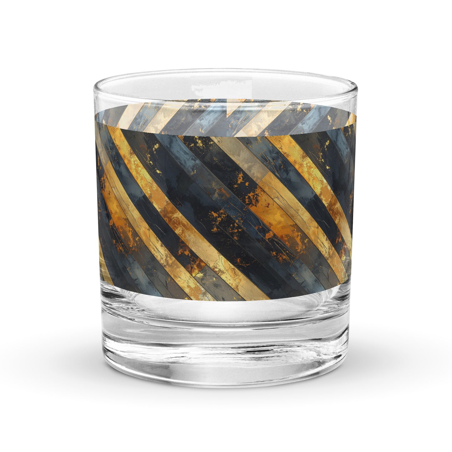 Rocks glass with decorative gold and black striped design on a white background