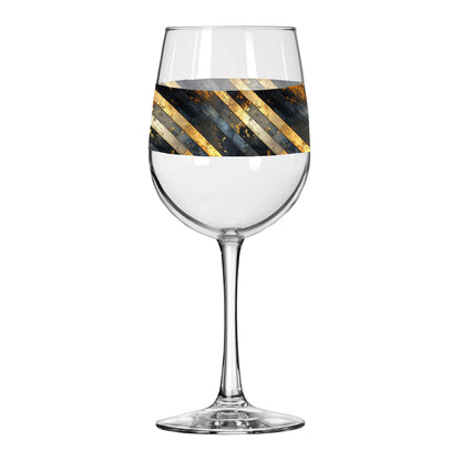 Wine glass with black and gold striped design on a white background