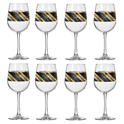 Set of eight wine glasses with black and gold striped designs on a white background