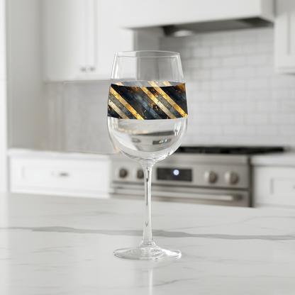 Obsidian Stripes tall wine glass black and gold diagonal stripes on a kitchen counter