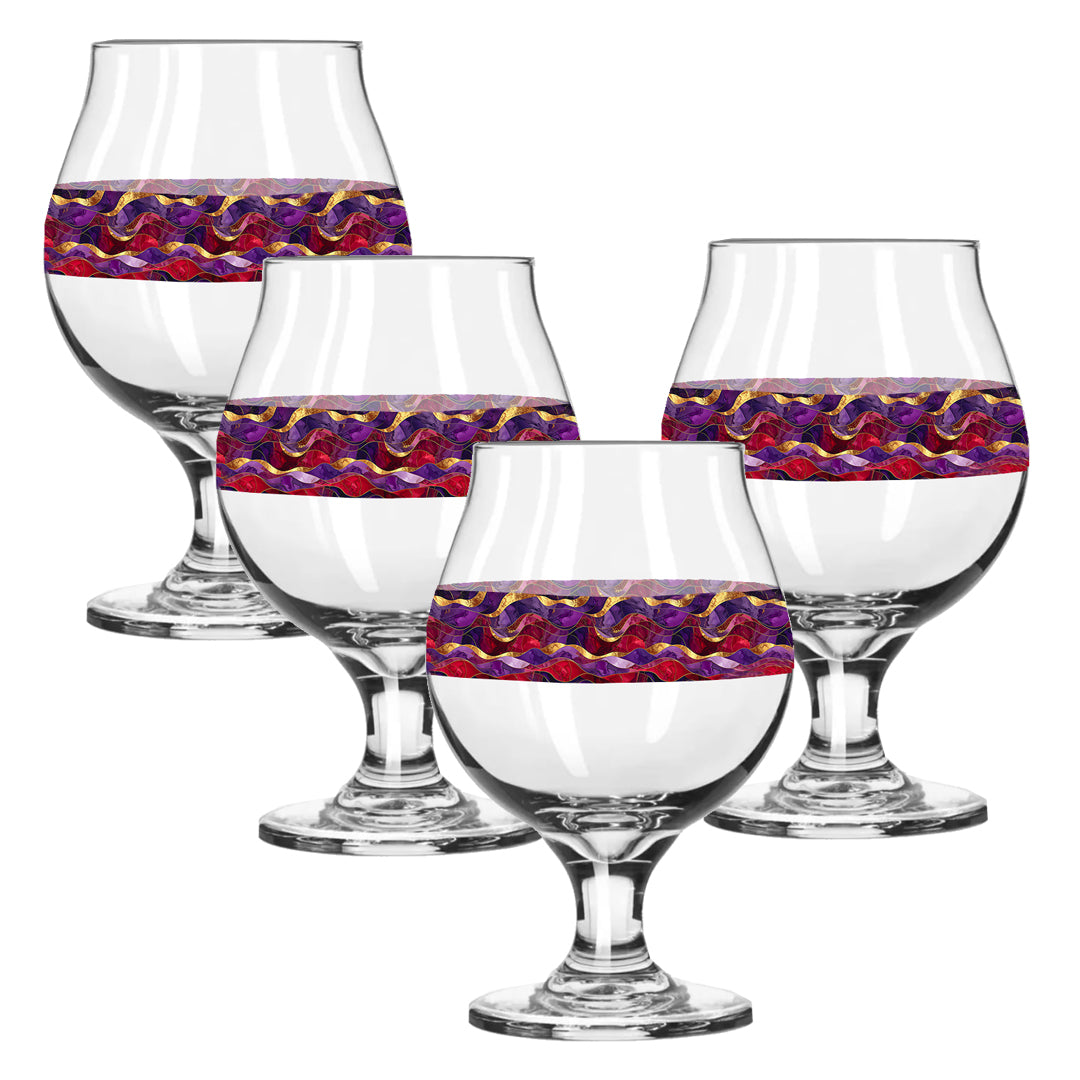 Set of four clear wine glasses with purple and gold colorful pattern on a white background