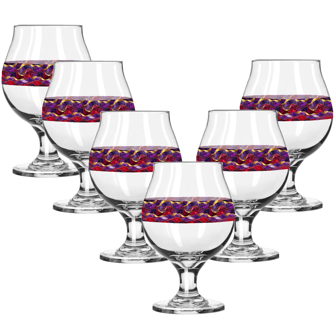 Set of six glass snifters with purple and gold colorful pattern on a white background