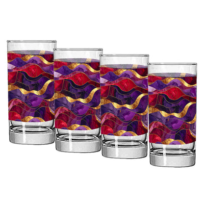 Set of four highball glasses with purple and gold colorful wavy pattern on a white background
