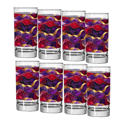 Set of eight purple and gold colorful highball glasses with wavy pattern on a white background