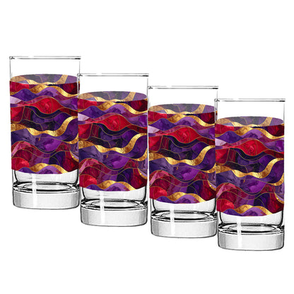 Set of four glass tumblers withpurple and gold colorful wavy pattern on a white background