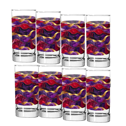 Set of eight purple and gold colorful glass tumblers with wavy pattern on a white background