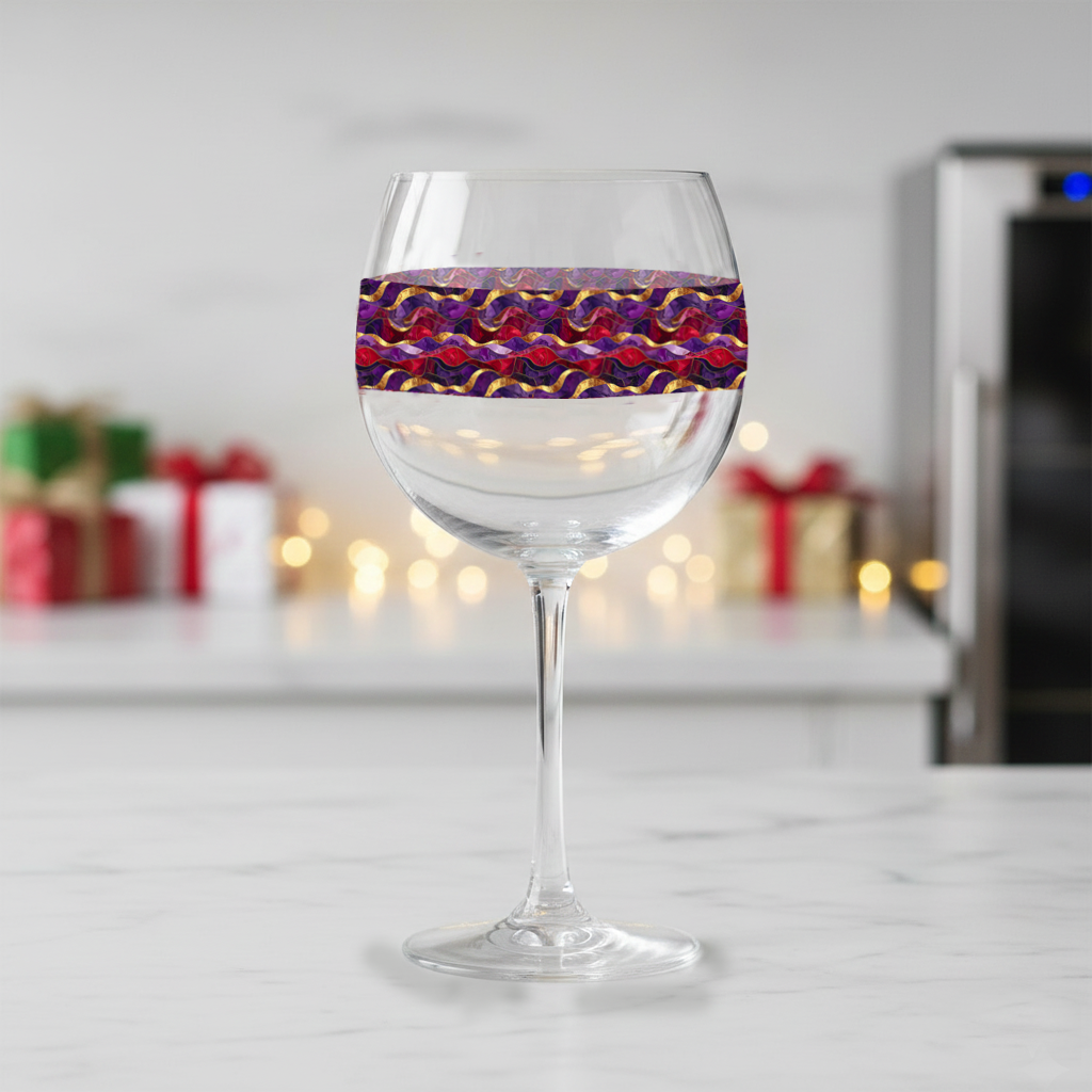 Fluid Marble balloon wine glass with purple and gold wavy design on a kitchen counter