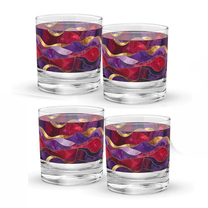Four glass tumblers with purple and gold colorful wavy patterns on a white background