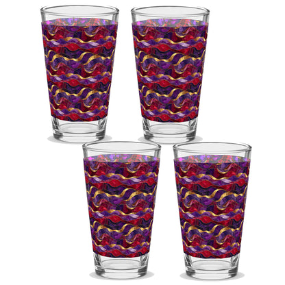 Four glass tumblers with a colorful wavy pattern on a white background