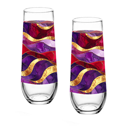 Two tall glasses with colorful wavy patterns on a white background