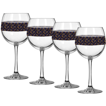 Set of four balloon wine glasses with sapphire and gold wrap design on a white background