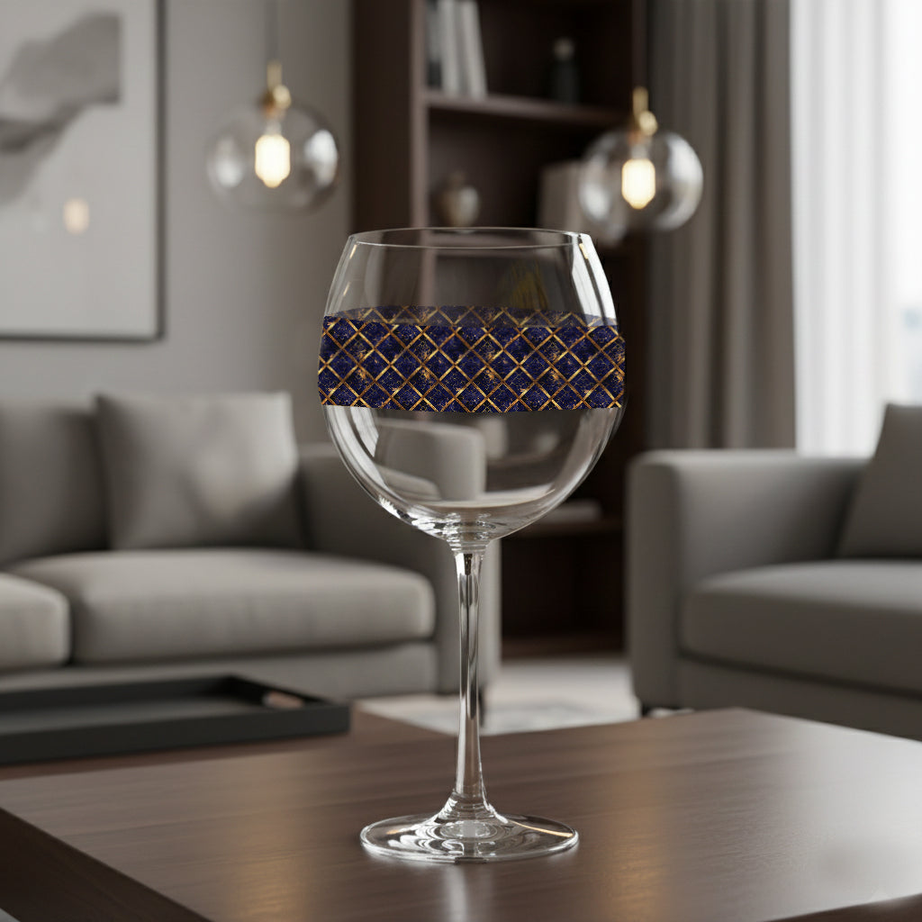 Regal Twilight balloon wine glass with sapphire and gold lattice design on a table in a living room setting